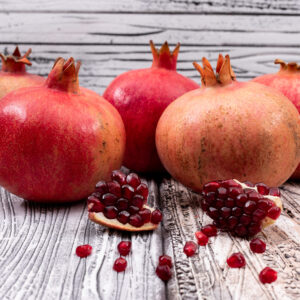 fresh pomegranate on wooden table